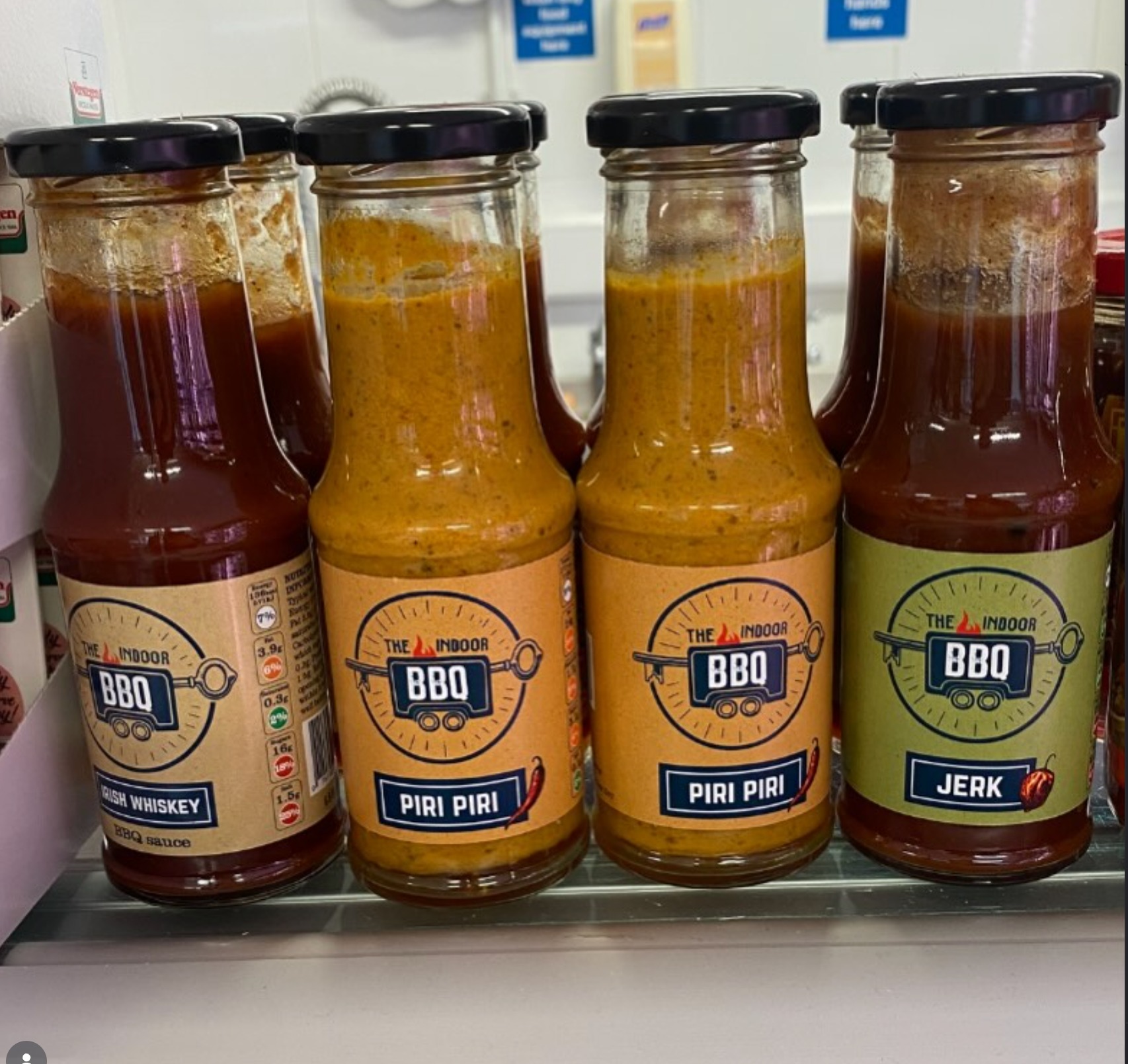 The Indoor BBQ full sauce range -- Irish Whiskey, Piri Piri, and Jerk BBQ bottles